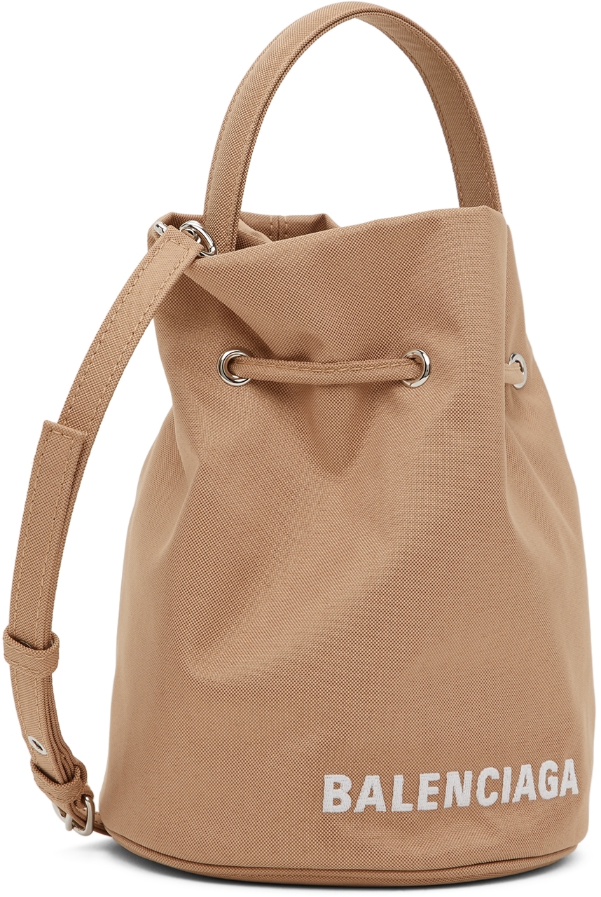 Balenciaga Beige XS Wheel Drawstring Bucket Bag - Realry: A global fashion  sites aggregator