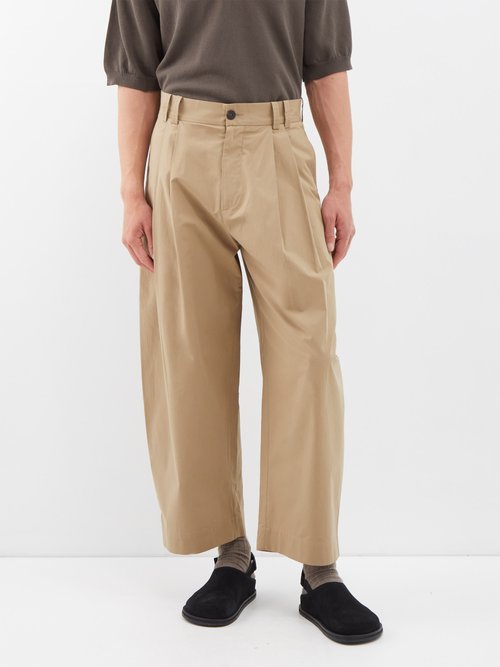 Studio Nicholson Yale pleated cotton trousers - Realry: A global