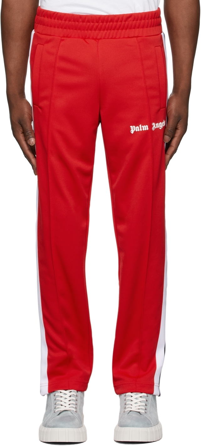 PALM ANGELS: jogging trousers with all over logo - Red